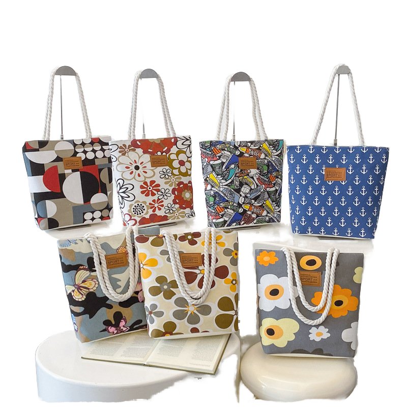 Wholesale women's artistic ethnic style canvas handbags, large capacity fashionable shoulder bags, printed letter patterns