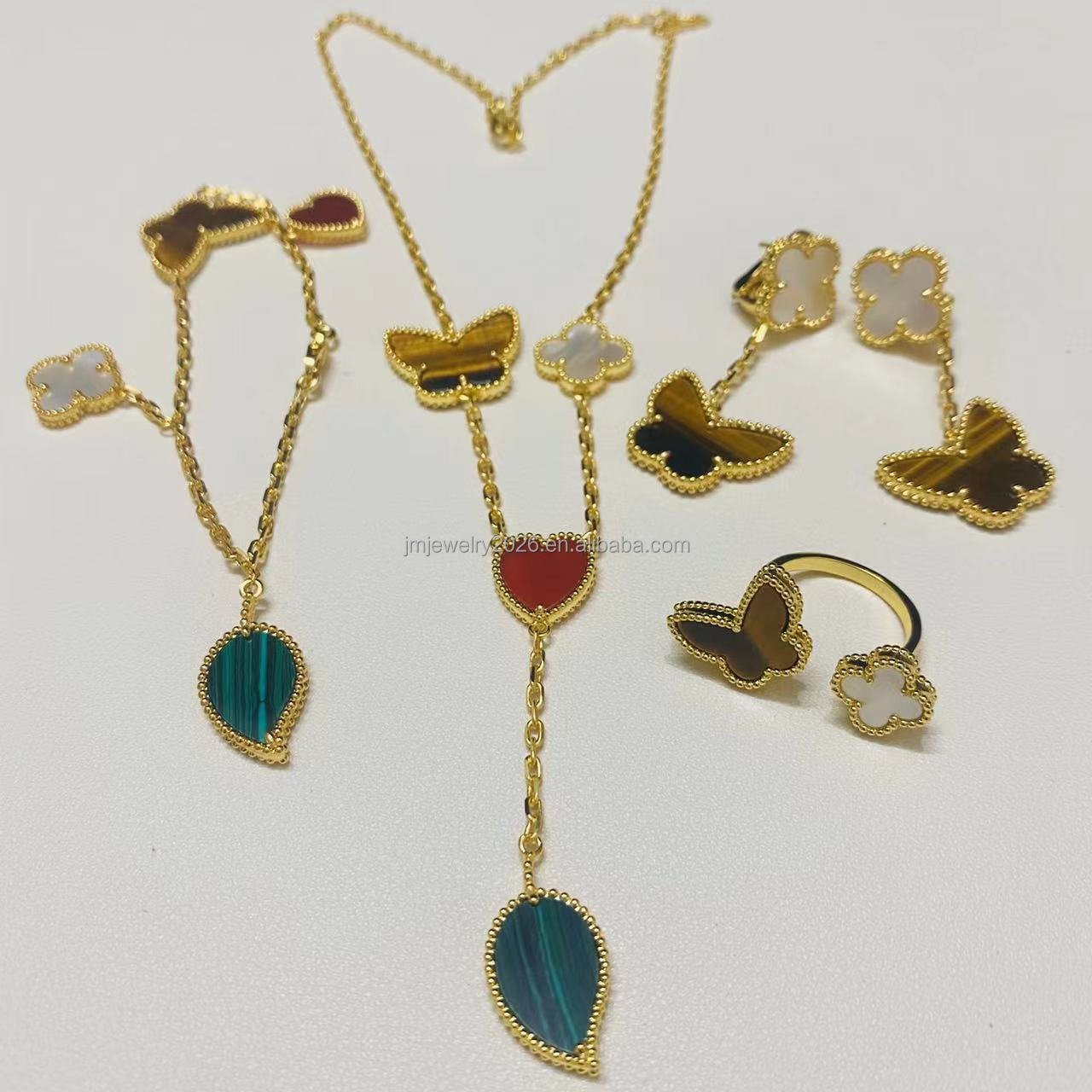 S925 pure silver high-end jewelry 18K gold ruby agate bracelet with four leaf flower light luxury style elegant texture wholesale